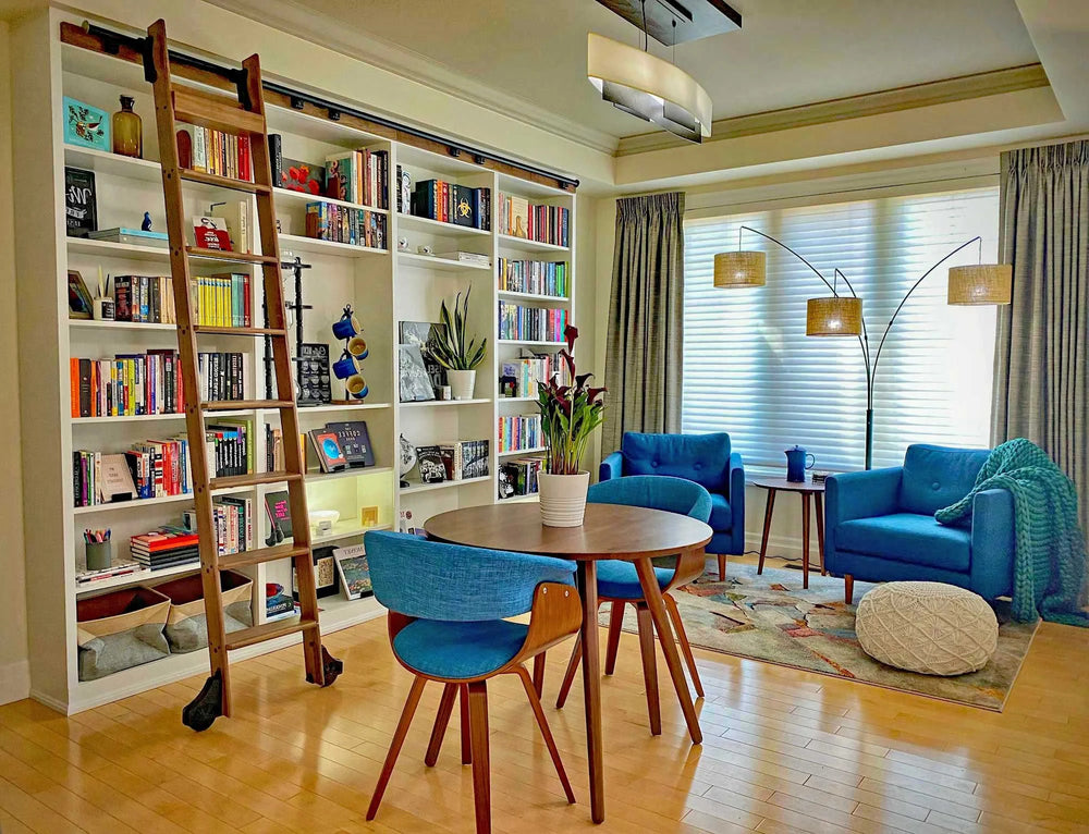Rolling library ladder built into custom shelving.