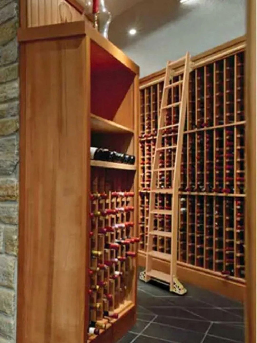 Wooden ladder on floor to ceiling wine racks.