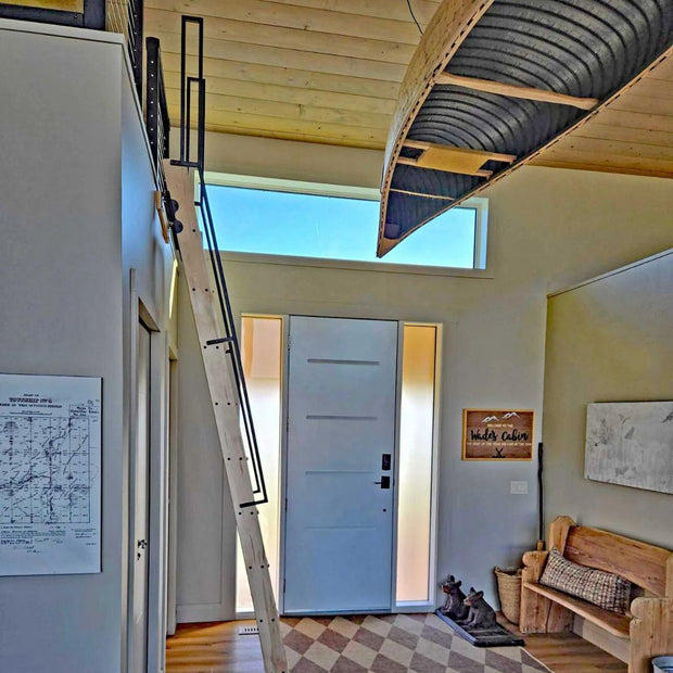 Custom steel handrails on a loft ladder with top and bottom mounts.