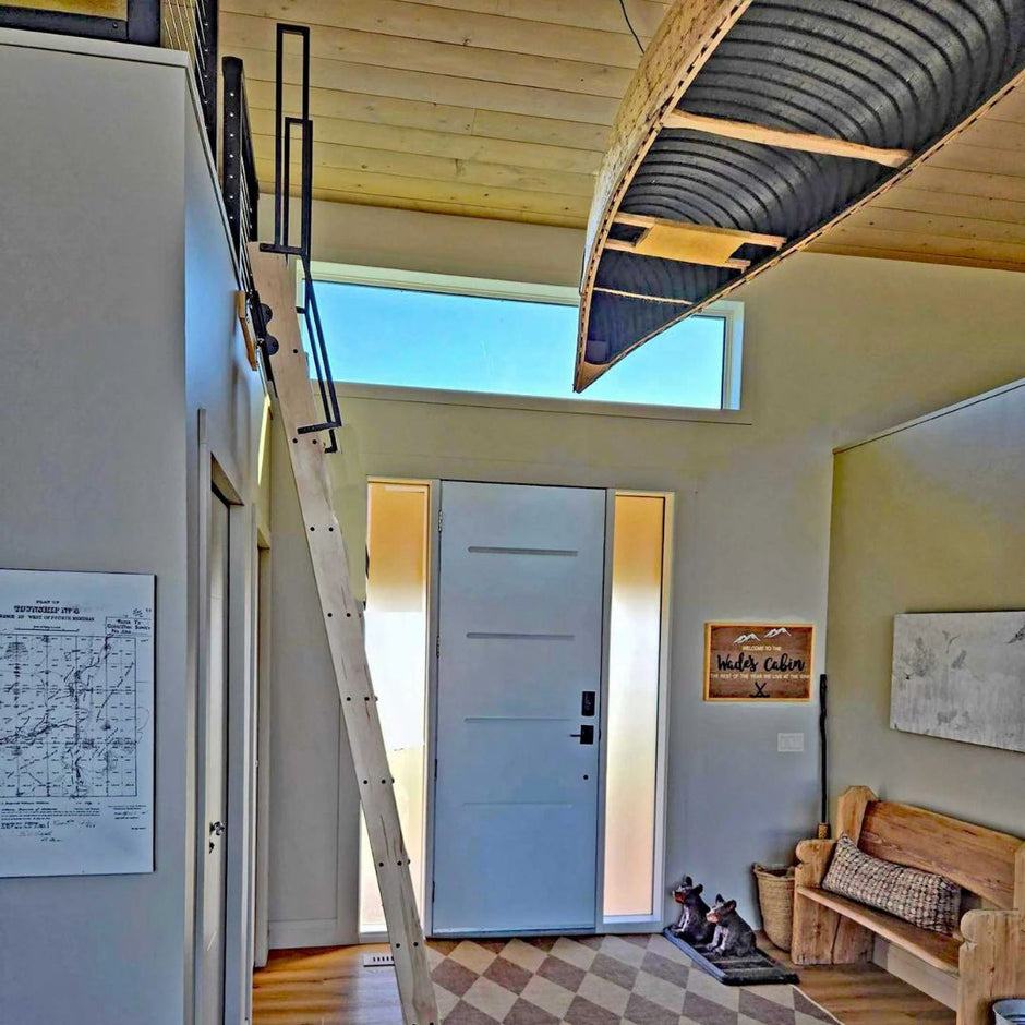 Custom steel handrails on a loft ladder with a top mount.