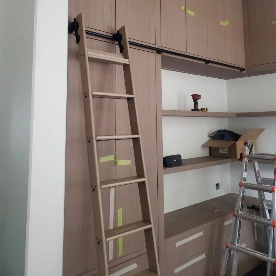 Library ladder kit in walnut, installed on shelving.