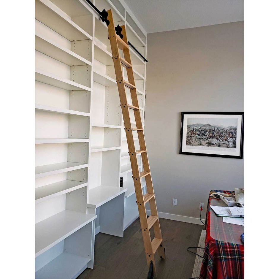 Library ladder kit in white oak, installed on shelving.
